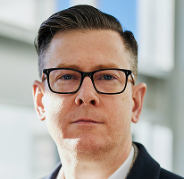 Photographie d'Alexander Hughes, PDG et responsable d'une société spécialisée dans le trading de cryptomonnaies